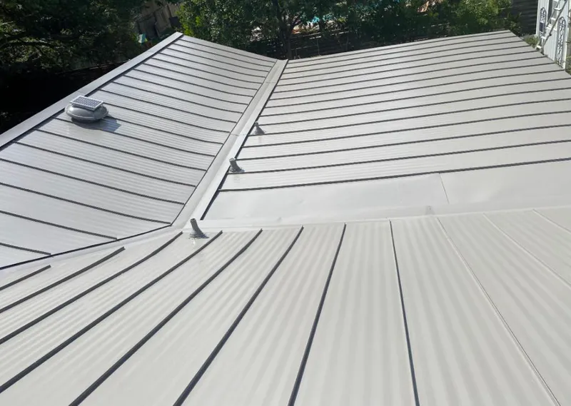 Solar attic fan installed on a metal roof for Roof Ventilation in Wildwood